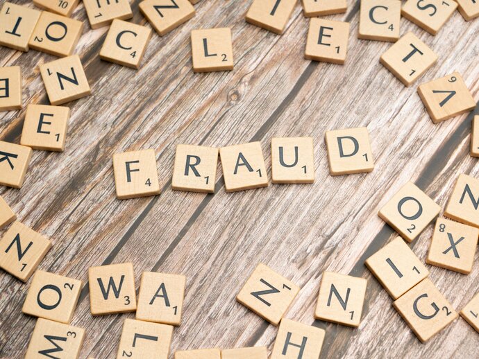scrabble tiles spelling out "fraud"