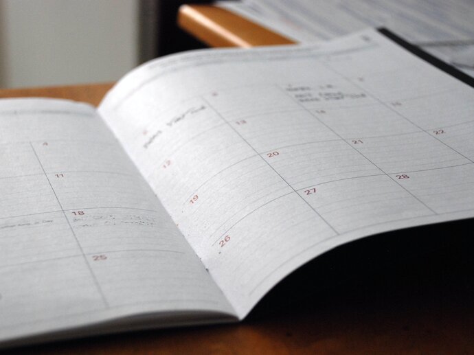 Photo of a diary laying open, with only one or two things written for the whole month