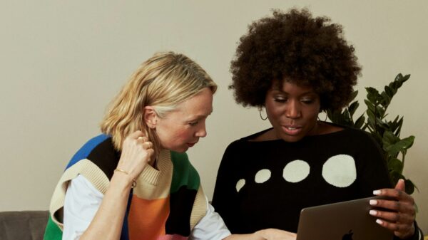 Two women looking at a computer