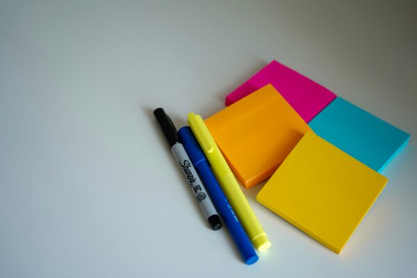 post-its and pens on a table